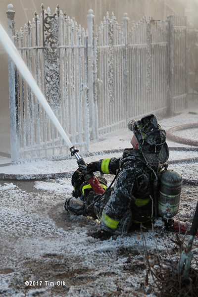 firefighter covered with ice after fire