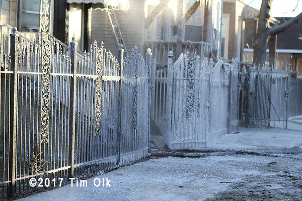 ice covered fence after fire