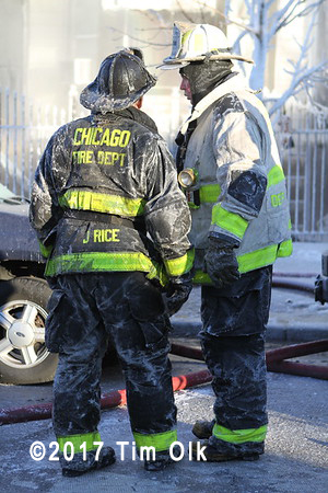 firefighters covered with ice after fire