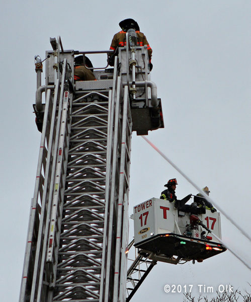 two tower ladders working at fire scene