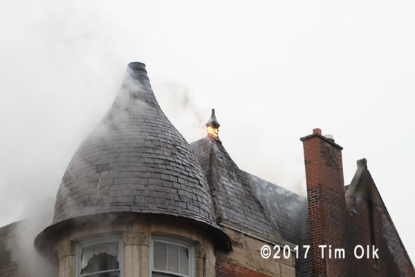smoke from roof to townhouse on fire