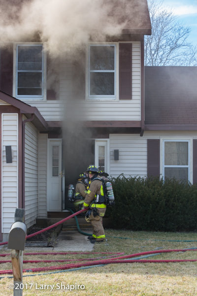 Firefighters make entry into house on fire
