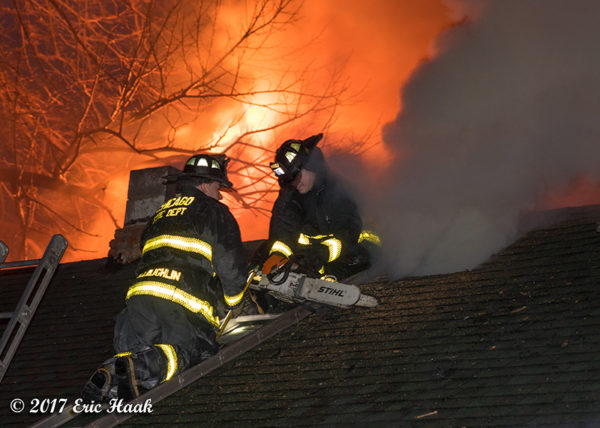 Chicago Firefighters on roof with flames