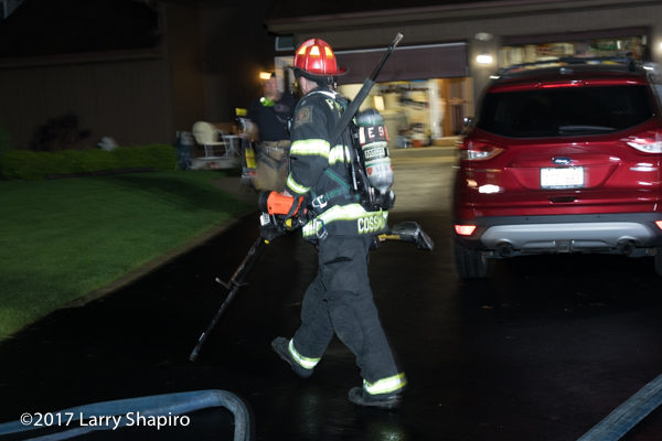 Firefighter with PPE and hand tools