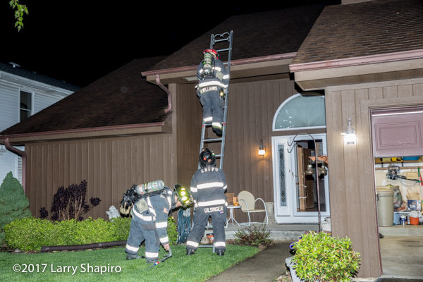 Firefighters descend ground ladder