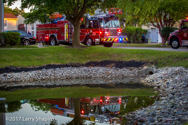 Buffalo Grove FD E-ONE Cyclone quint reflecting in a pond
