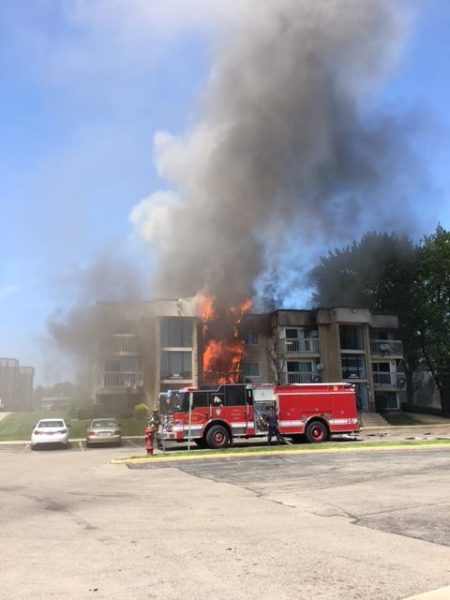 flames burn through apartments