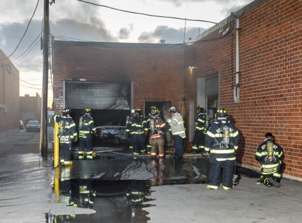 firefighters at commercial building fire
