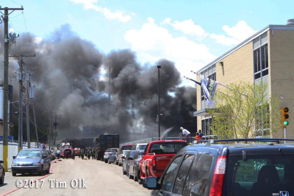 heavy black smoke from junkyard fire