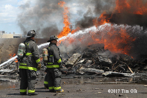 firefighters battle junk yard fire