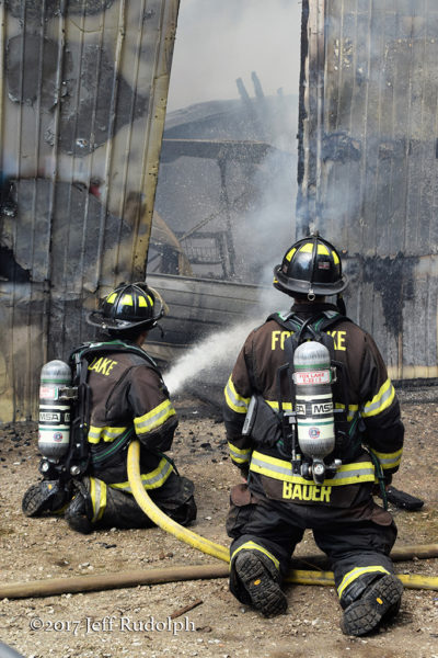 firefighters battling a warehouse fire