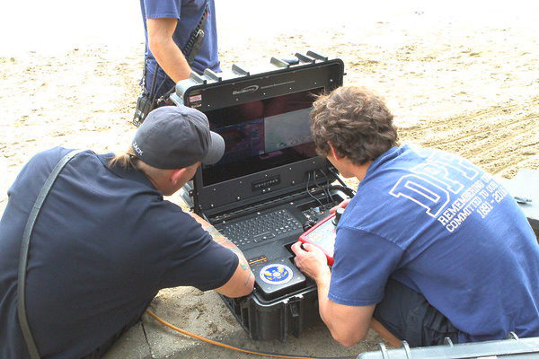 firefighters monitor sonar 