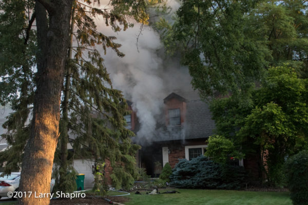 heavy smoke pushes from house on fire
