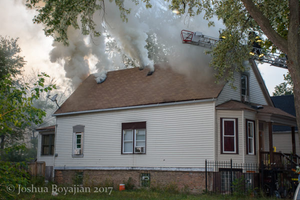 smoke vents from roof of house on fire