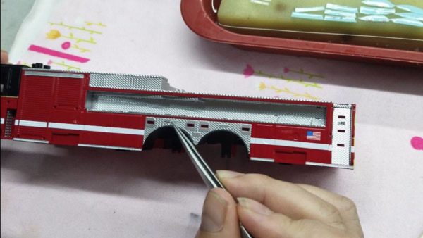 assembling a scale model of a Chicago fire truck