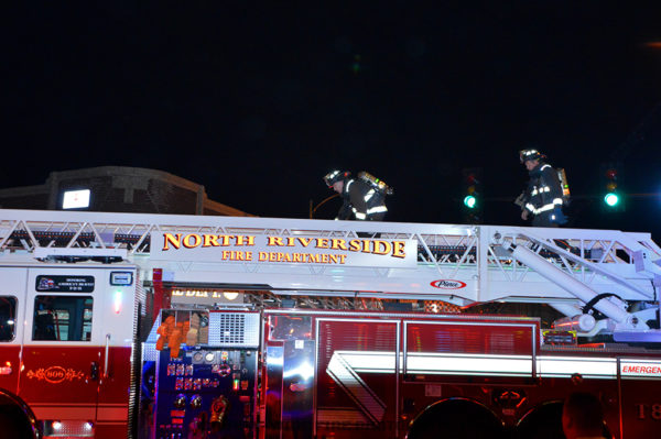 firefighters climb ladder