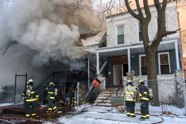 Chicago firefighters battle winter house fire