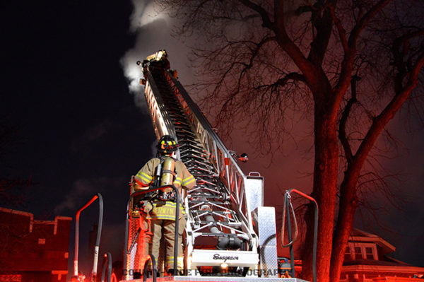 Seagrave aerial ladder truck at fire scene