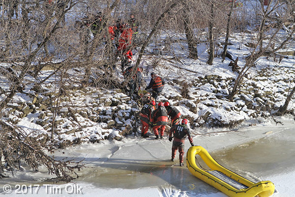 FD divers rescue a victim from a frozen river