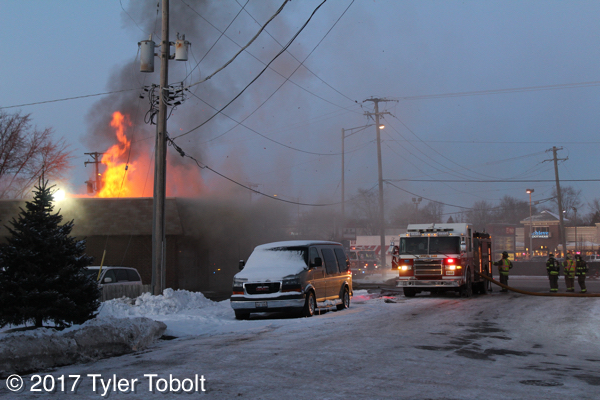 heavy smoke and flames from commercial fire in Crystal Lake