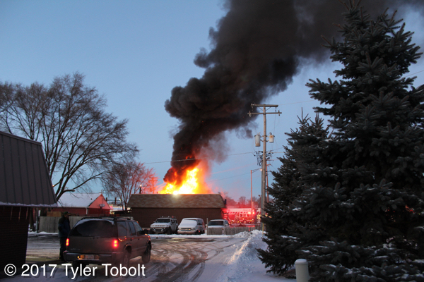 heavy smoke and flames from commercial fire in Crystal Lake