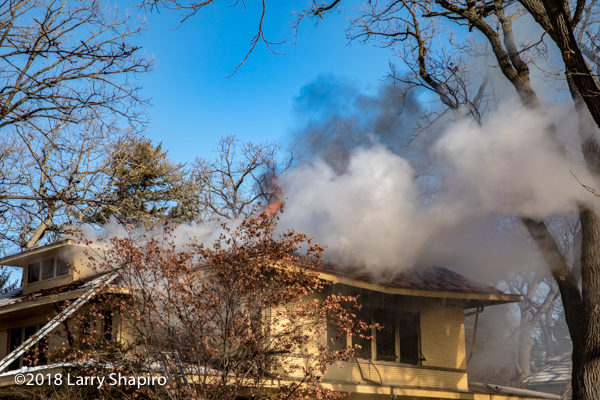 heavy smoke and flames from house on fire