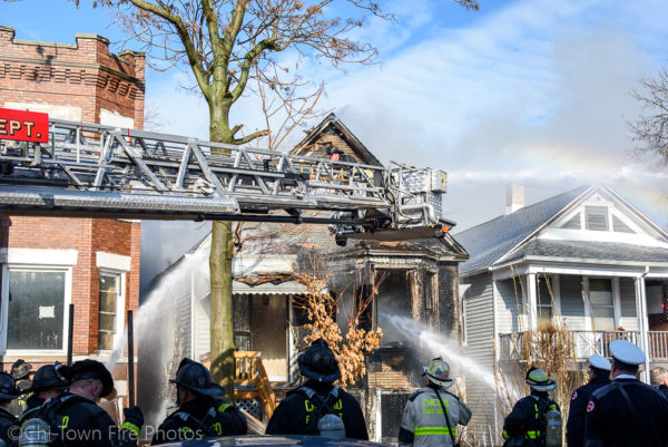 Chicago firefighters battle fire in a house