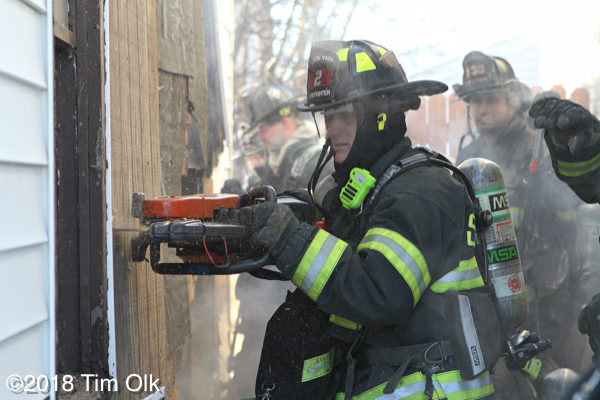 firefighter uses a saw