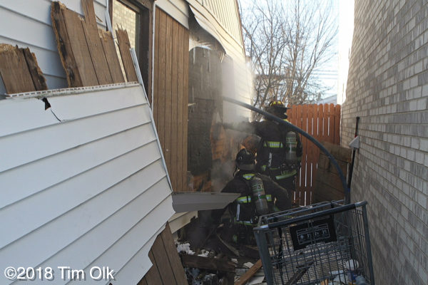 firefighters overhaul after a house fire