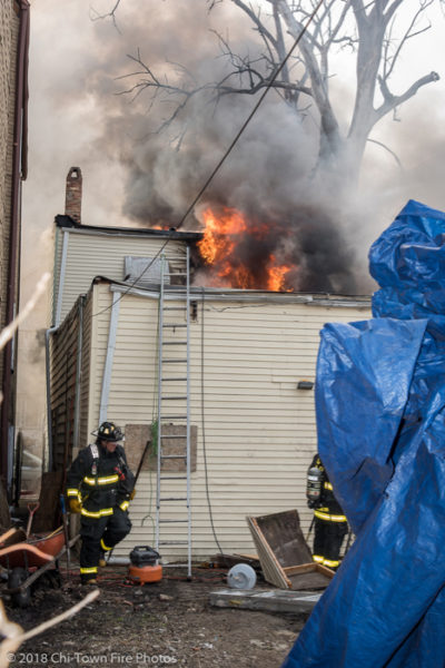 flames from roof of house on fire