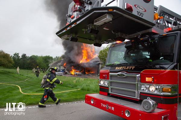 flames engulf suburban home