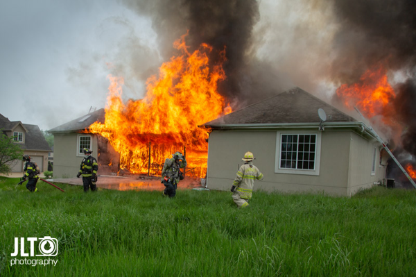 flames engulf suburban home