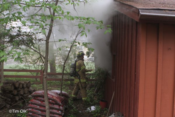 Firefighters fight garage fire
