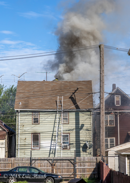 smoke from roof of Chicago house on fire