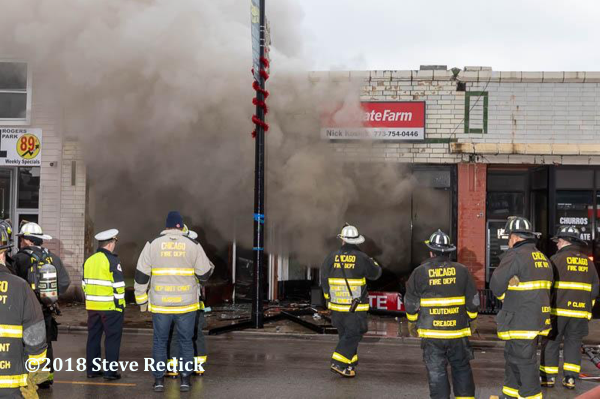 Chicago Firefighters battle a store front fire