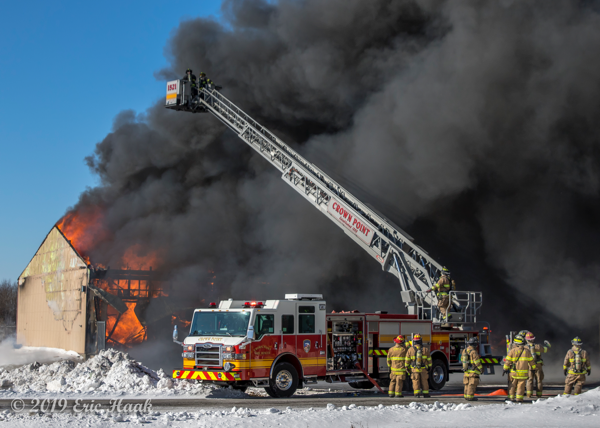 Crown Point FD quint battles a fire with heavy black smoke