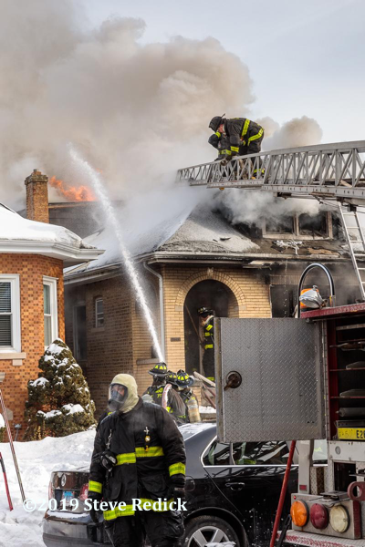 heavy smoke and flames from Chicago bungalow fire