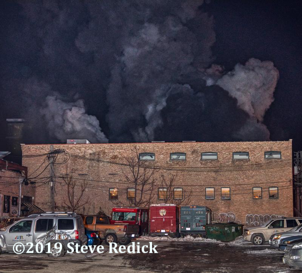industrial building fire with heavy smoke