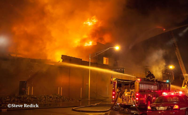 massive warehouse fire at night