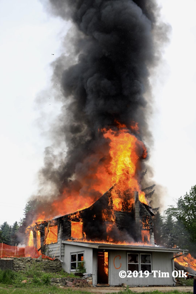 house engulfed in flames