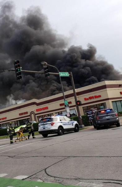 heavy black smoke from commercial building fire