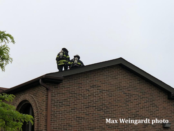 Firefighters on building roof