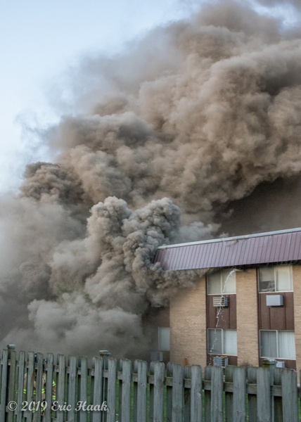 heavy smoke as Firefighters battle apartment building fire