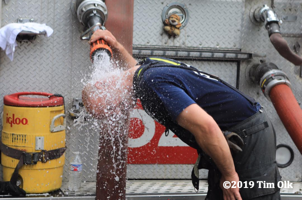 Firefighters cools off on hot day