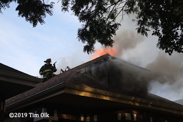 flames through roof of Chicago bungalow