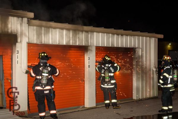 firefighters battle fire in a self storage facility