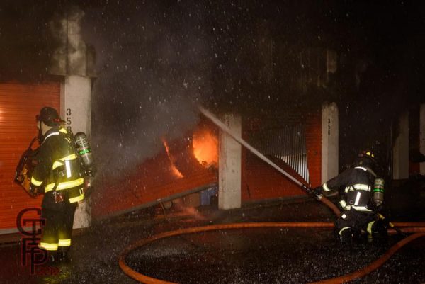 firefighters battle fire in a self storage facility
