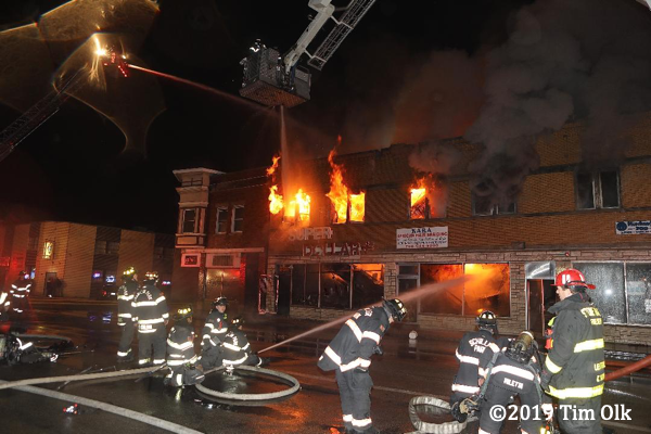 commercial buildings engulfed by fire