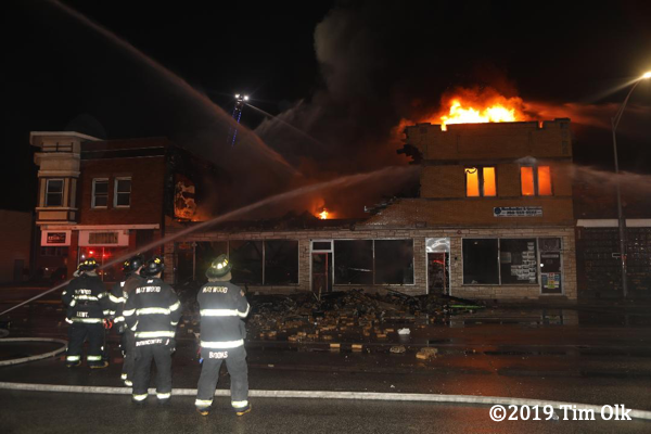 commercial buildings engulfed by fire