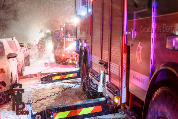 Firefighters battle building fire in blizzard
